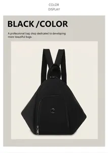 Detail of black geometric backpack with textured triangle pattern and metal logo