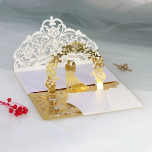 Detailed 3D laser-cut wedding invitation with gold mirror foil and couple silhouette