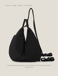 Side view detail of a black nylon waterdrop backpack with minimalist zipper and straps