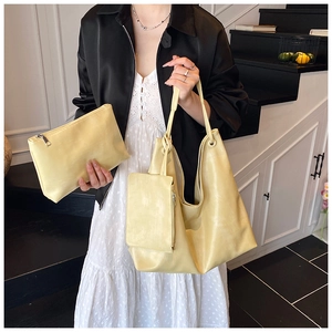 Three-piece beige tote bag set with large shoulder bag, clutch pouch and small coin purse