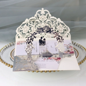 Detailed laser-cut lace design on white wedding card with 3D silver mirror silhouette