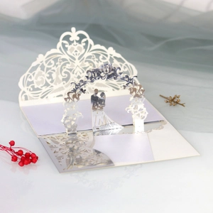3D laser cut wedding invitation with elegant floral arch and bridal silhouette detail