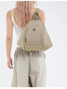 Khaki nylon backpack with geometric triangle design and round metal logo detail
