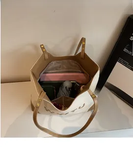 Detail view of large canvas tote bag showing interior compartments and ample storage space