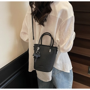 Litchi pattern bucket bag with horse charm and detachable strap on casual model