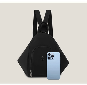 Detailed view of black triangular backpack with phone for size comparison reference
