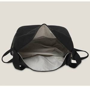 Top view of spacious interior with herringbone lining and durable metal zipper detail