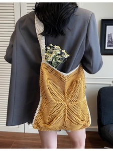Handmade crochet tote bag in vibrant yellow and white with geometric woven patterns