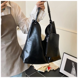 Black high-gloss PU leather tote bag shown with matching square zippered coin purse