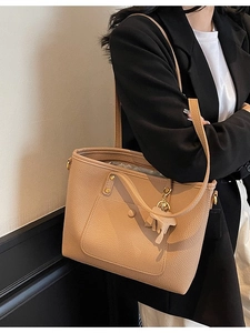 Chic apricot faux leather tote bag with lychee texture and cute elephant charm