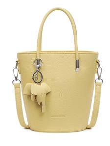 Pale yellow bucket bag in pebble leather with top handle and elephant charm