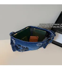 Spacious interior of denim tote bag showing room for tablets and wallets