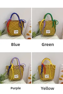 Detail view of woven straw handbags in four colors with drawstring closures and top handles