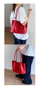 Detailansicht der großen roten Shopper-Tasche aus hochwertigem Leder mit feiner Narbung