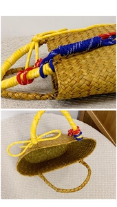 Detail view of woven straw beach bag featuring vibrant yellow rope handles and decorative knots