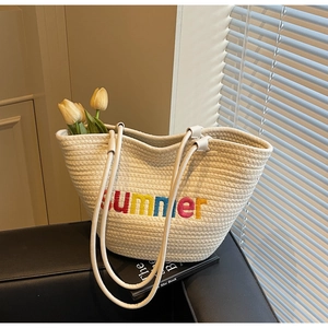 Detail of woven cotton tote bag with colorful Summer embroidery and elegant tulips