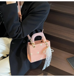Pink daisy floral crossbody bag with pearl chain detail and lace trim accents