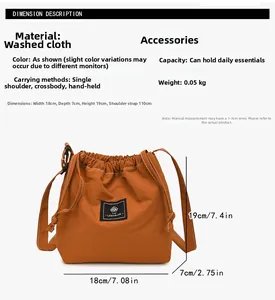 Detail view of small orange drawstring bucket bag in washed fabric with dimensions