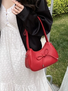 Fashionable red bow shoulder bag made of lychee texture leather for stylish women