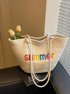 Off-white cotton rope woven tote bag with colorful summer embroidery for casual beach travel