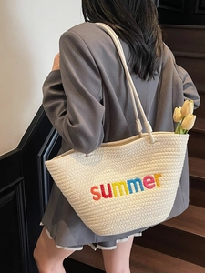 Large woven tote bag with colorful summer embroidery on shoulder strap for women