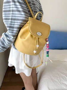 Ginger yellow PU leather bucket backpack with white rabbit badge and colorful bead charm