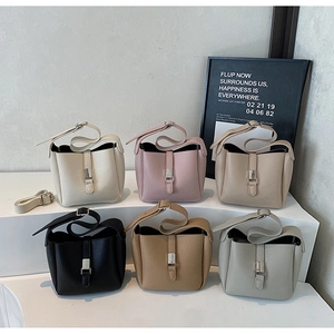 Litchi texture leather bucket bags in six colors with silver hardware and shoulder straps
