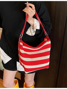Striped red and white woven hobo bag with red leather trim and silver metal rings