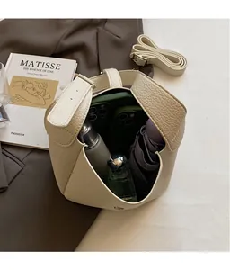 Detailed interior view of the large capacity lychee pattern shoulder bag with essentials