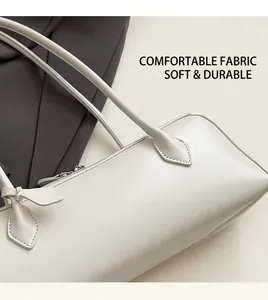 Detailed macro view of soft cream faux leather texture and metallic strap hardware