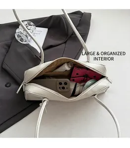 Detailed view of the white leather bag interior showing large capacity for essentials
