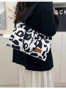 Fashionable cow print canvas tote bag with large capacity and adjustable strap for women