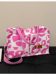 Pink leopard print canvas tote bag with double pockets and adjustable shoulder strap