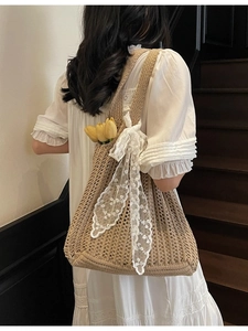French style woven tote bag with a white lace bow and floral accent detail