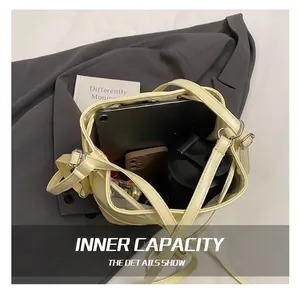 Detail showing spacious interior of the cream yellow bucket bag with daily essentials