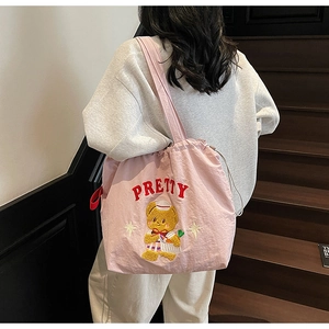 Pink tote bag detail with red Pretty letter embroidery and cute 3D cartoon bear