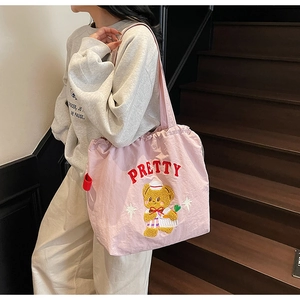 Detail of pink tote bag featuring Pretty text and cartoon sailor bear embroidery design