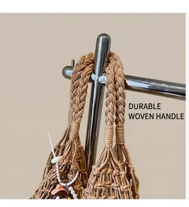 Detail of khaki woven tote bag showing chunky handles and intricate mesh texture