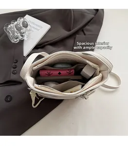 Internal view of the cream bucket bag showing large capacity and multi-pocket layout