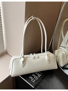 Elegant off-white rectangular underarm bag with double slim shoulder straps and zippers