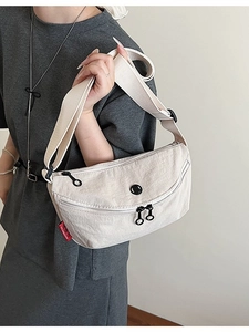 Minimalist beige nylon crescent crossbody bag with adjustable wide shoulder strap
