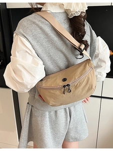 Lightweight khaki nylon crescent crossbody bag with wide shoulder strap for women