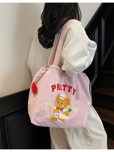 Pink drawstring tote bag with Pretty bear embroidery in a preppy college style