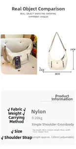 Détail du sac croissant en nylon beige montrant les dimensions 38x19cm et la sangle ajustable