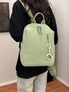 Light green textured nylon backpack with large capacity and stylish pleated finish