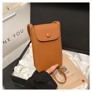 Brown litchi leather phone bag with flap buckle and shoulder strap in a gift box