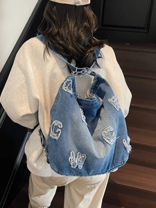 Blue denim backpack tote with vintage distressed letter patches for women's street style