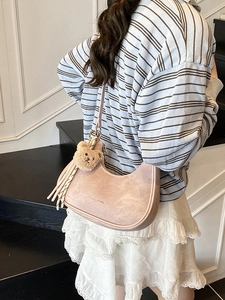 Pink crescent hobo underarm bag with cute bear charm and tassel detail for women