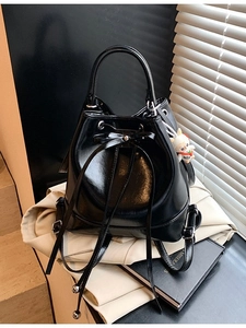 Fashionable black PU leather bucket backpack with bow detail and rabbit plush charm