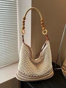 Handwoven woven shoulder bag with wooden beads and yellow ring details for summer